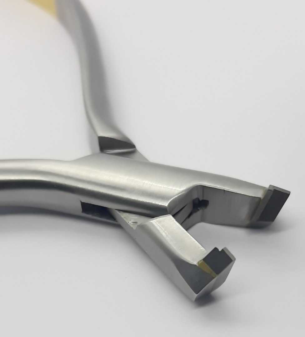 Orthodontic forceps for cutting and holding wire. Orthodontic forceps for cutting and holding wire.